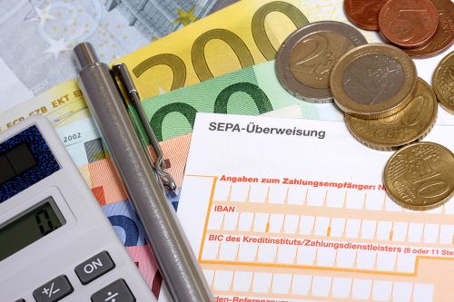 Erlagschein und Münzen